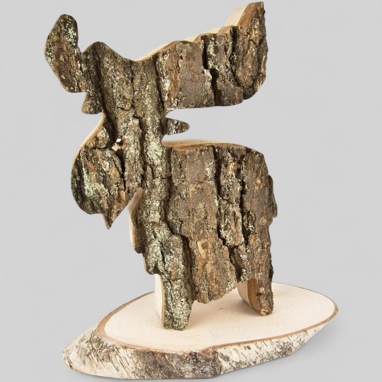 A decorative alder moose on a rustic wooden board with bark