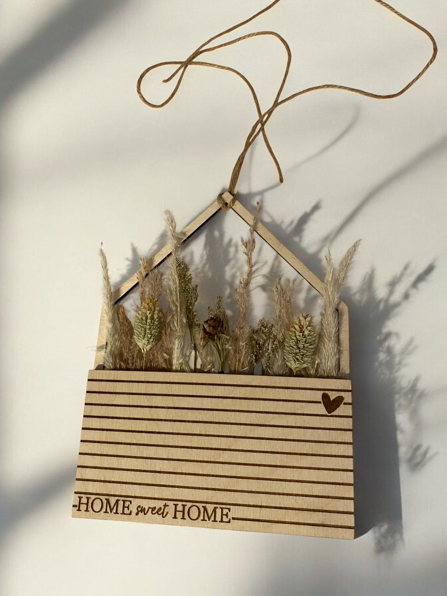 Hanging house with pocket for dried flowers