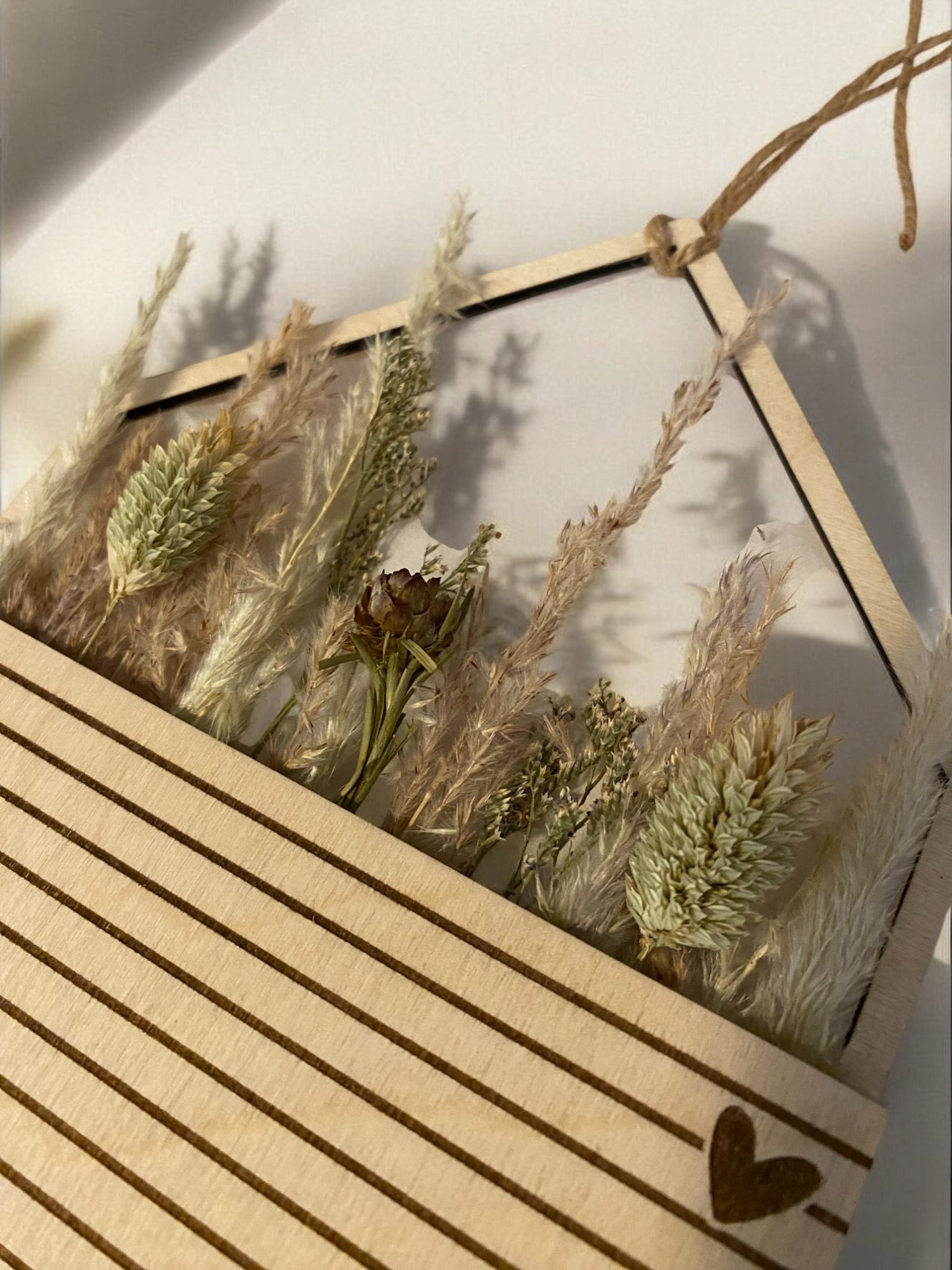 Hanging house with pocket for dried flowers