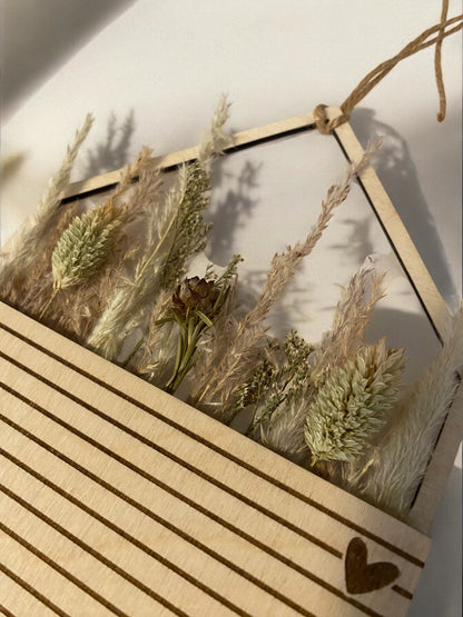 Hanging house with pocket for dried flowers