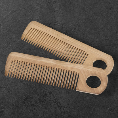 Natural wooden comb with grip holes for hair and beard made of maple wood
