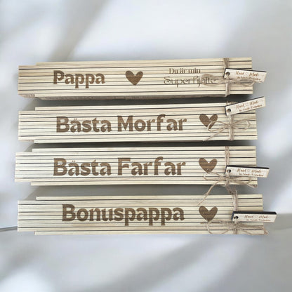 Personligt graverad tumstock